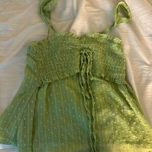 This top is green with little yarn dots. From shein for $5